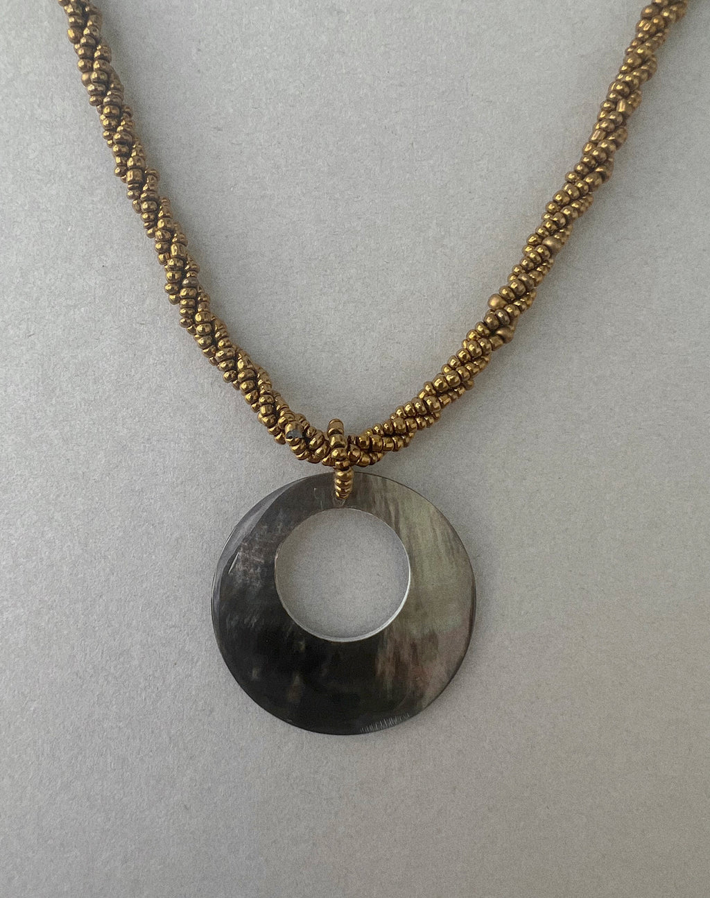 Arma Necklace with Round Shell Pendant in Gold