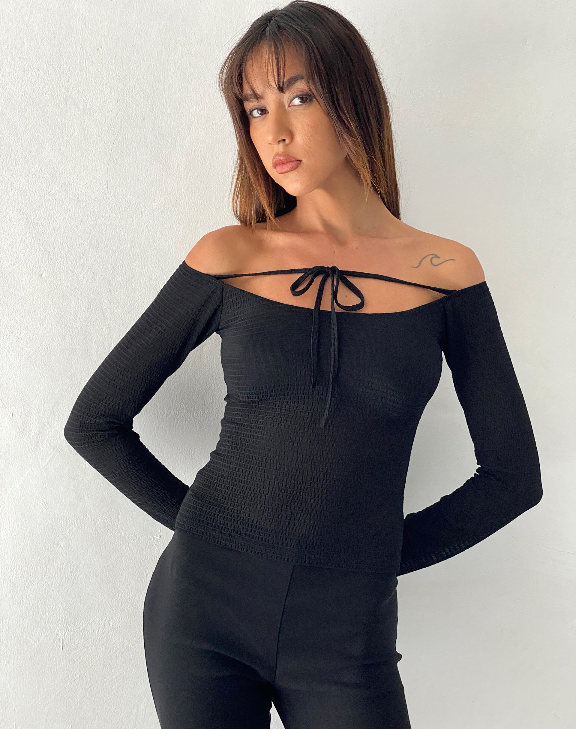 Image of Alondra Long Sleeve Tie Front Top in Textured Black