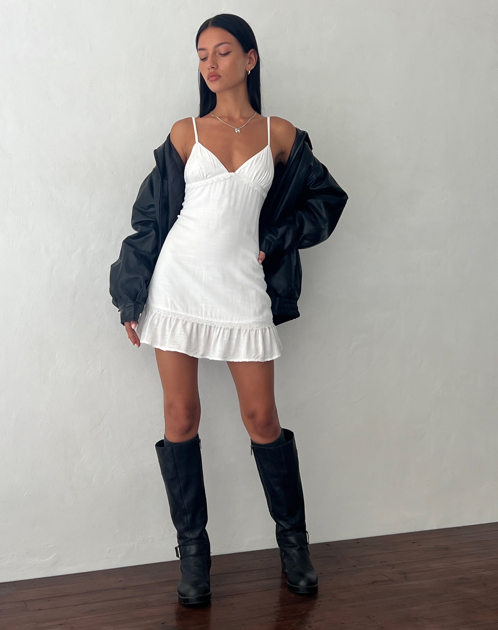 white dress and black boots White Frill Mini Dress