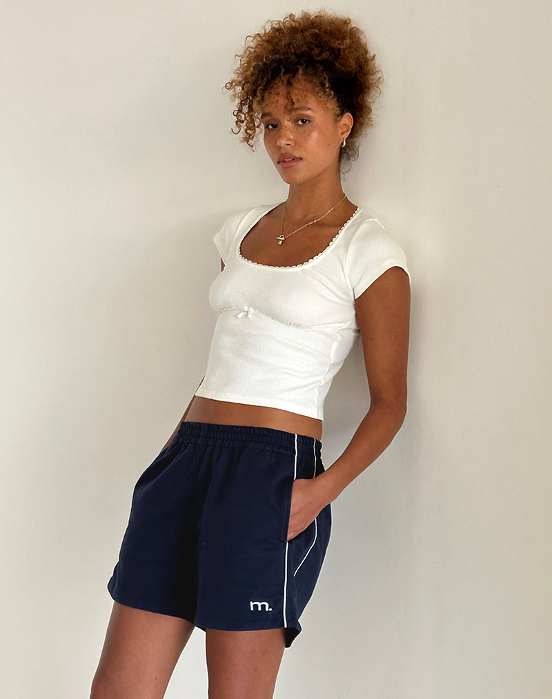 Image of Thera Short in Navy with White Piping with M Emb